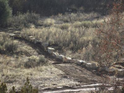 Boulders placed to keep vehicles off stream bank